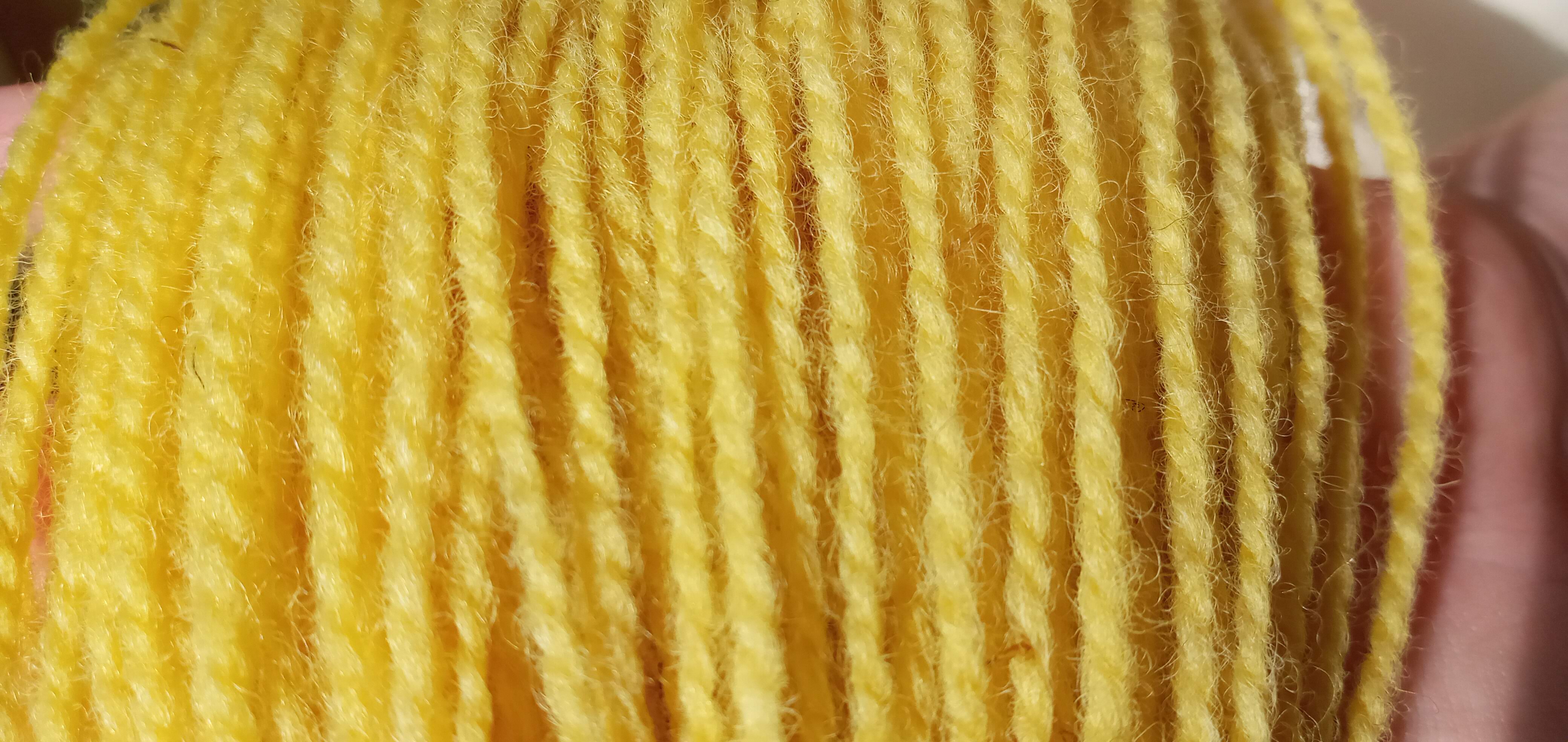 Close up of bright yellow yarn.